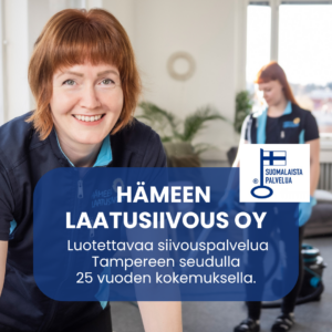 Iloinen Hämeen Laatusiivouksen siivooja ja avainlippu